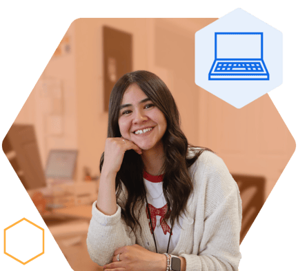 Student Success Coach sitting at a desk and smiling